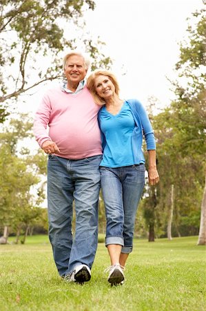 simsearch:400-04035087,k - Senior Couple Walking In Park Stock Photo - Budget Royalty-Free & Subscription, Code: 400-05736240