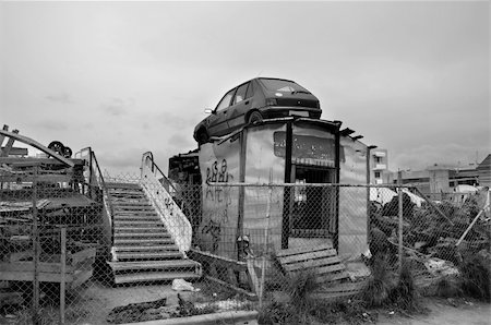 Rusty car and scrap metal at a junkyard. Black and white. Stock Photo - Budget Royalty-Free & Subscription, Code: 400-05738379