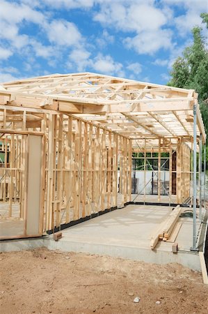 New residential construction home Wooden framing against a blue sky Stock Photo - Budget Royalty-Free & Subscription, Code: 400-05738538