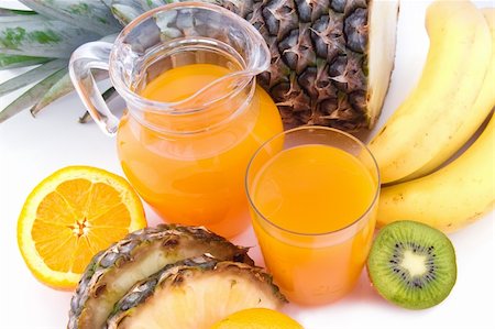 simsearch:400-05664137,k - Jug and glass of multivitamin juice with pineapple and orange Stock Photo - Budget Royalty-Free & Subscription, Code: 400-05738938