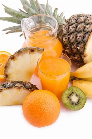 simsearch:400-05664137,k - Jug and glass of multivitamin juice with pineapple and orange Stock Photo - Budget Royalty-Free & Subscription, Code: 400-05738939