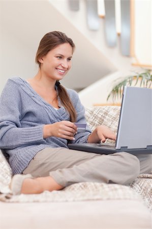 simsearch:400-04410667,k - Portrait of a woman shopping online in her living room Stock Photo - Budget Royalty-Free & Subscription, Code: 400-05739917