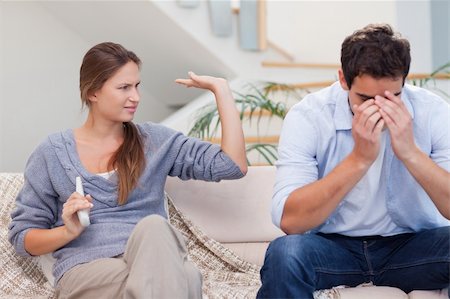 Man being tired of arguing with his wife in their living room Stock Photo - Budget Royalty-Free & Subscription, Code: 400-05739940