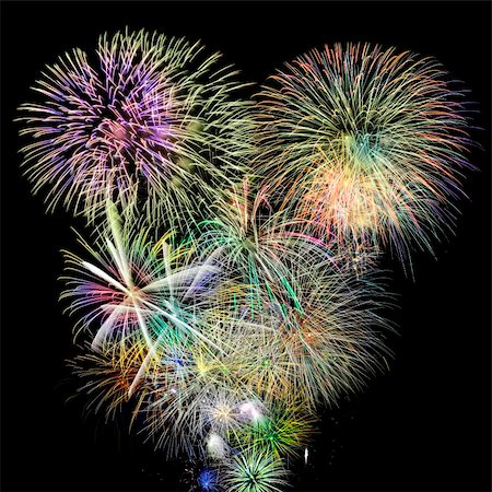 Colorful background of fireworks over a night sky Stock Photo - Budget Royalty-Free & Subscription, Code: 400-05730528