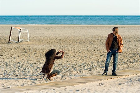 photographers taking pictures of models - Woman taking photographs of a teenager on the beach Stock Photo - Budget Royalty-Free & Subscription, Code: 400-05730553