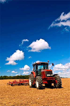 Small scale farming with tractor and plow in field Stock Photo - Budget Royalty-Free & Subscription, Code: 400-05731792