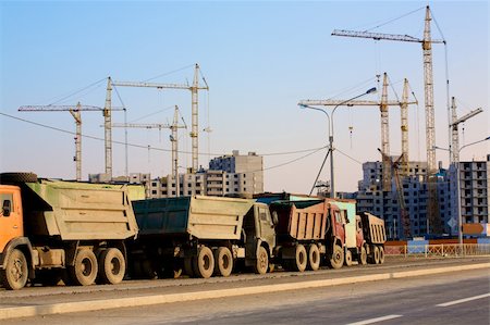Trucks standing in a line at a housing construction site in St. Petersburg, Russia Stock Photo - Budget Royalty-Free & Subscription, Code: 400-05732185