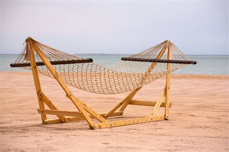 A view of a wooden framed hammock on a beach at the Red Sea on a summer day. Stock Photo - Budget Royalty-Free & Subscription, Code: 400-05732191