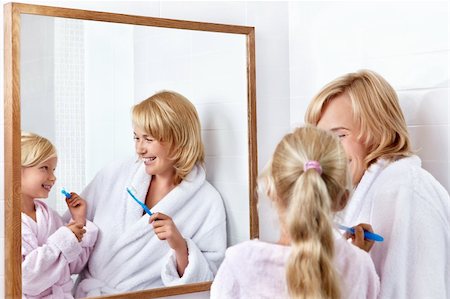 simsearch:400-04151135,k - Mother and daughter brushing their teeth in the bathroom Stock Photo - Budget Royalty-Free & Subscription, Code: 400-05732854