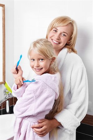 simsearch:400-04151135,k - Mother and daughter brushing their teeth in the bathroom Stock Photo - Budget Royalty-Free & Subscription, Code: 400-05732853