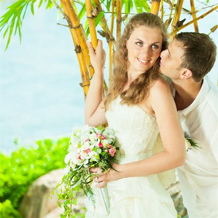 simsearch:400-05328142,k - Bride and groom on the beach. Tropical wedding Stock Photo - Budget Royalty-Free & Subscription, Code: 400-05733443