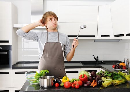 simsearch:400-05744780,k - Man cooking in modern kitchen Stock Photo - Budget Royalty-Free & Subscription, Code: 400-05744784