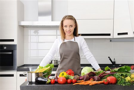 simsearch:400-05744780,k - Woman cooking in modern kitchen Stock Photo - Budget Royalty-Free & Subscription, Code: 400-05744780