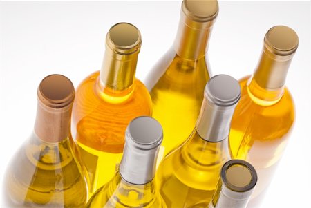 simsearch:400-04226436,k - White wine bottles back lit by a yellow spot light Stock Photo - Budget Royalty-Free & Subscription, Code: 400-05745002