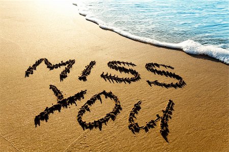 summer text message - Dramatic inscription "Miss You" on wet golden beach sand in sunset light Foto de stock - Super Valor sin royalties y Suscripción, Código: 400-05745256