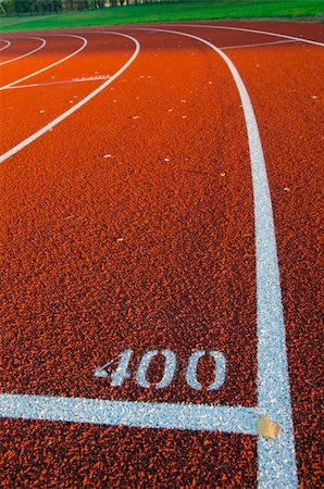 running on empty - evening light on autumn stadium red track Stock Photo - Budget Royalty-Free & Subscription, Code: 400-05745297