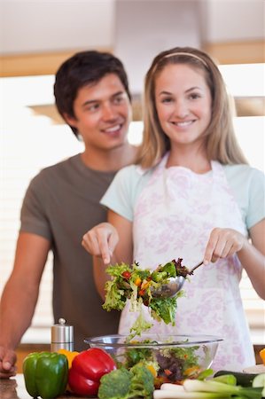 simsearch:400-05744780,k - Portrait of a couple making a salad in their kitchen Stock Photo - Budget Royalty-Free & Subscription, Code: 400-05746845