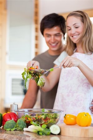 simsearch:400-05744780,k - Portrait of a young couple making a salad in their kitchen Stock Photo - Budget Royalty-Free & Subscription, Code: 400-05746846