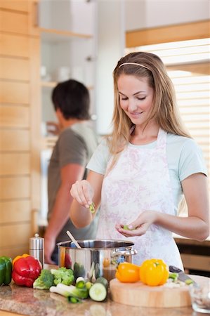 simsearch:400-05740111,k - Portrait of a couple cooking in their kitchen Stock Photo - Budget Royalty-Free & Subscription, Code: 400-05746849