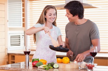 simsearch:400-05740111,k - Couple cooking dinner in their kitchen Stock Photo - Budget Royalty-Free & Subscription, Code: 400-05746868