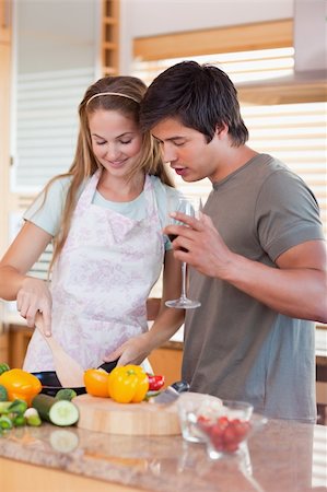 simsearch:400-05740111,k - Portrait of a couple cooking while drinking wine in their kitchen Stock Photo - Budget Royalty-Free & Subscription, Code: 400-05746879