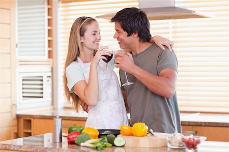 simsearch:400-05740111,k - Lovely couple drinking wine in their kitchen Stock Photo - Budget Royalty-Free & Subscription, Code: 400-05746873