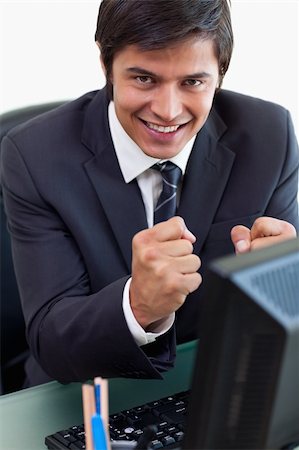simsearch:400-05748170,k - Portrait of a satisfied businessman working with a computer in his office Stock Photo - Budget Royalty-Free & Subscription, Code: 400-05746924