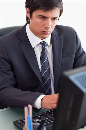 simsearch:400-05748170,k - Portrait of a businessman working with a computer in his office Stock Photo - Budget Royalty-Free & Subscription, Code: 400-05746920