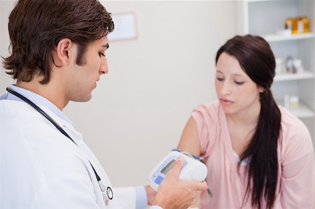 simsearch:400-05748252,k - Female patient having her blood pressure checked Stock Photo - Budget Royalty-Free & Subscription, Code: 400-05747076