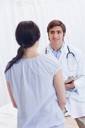 simsearch:400-05748252,k - Young male physician talking with patient Stock Photo - Budget Royalty-Free & Subscription, Code: 400-05747115