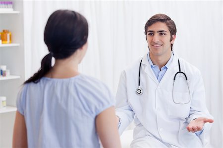 simsearch:400-05748252,k - Young physician having a conversation with patient Stock Photo - Budget Royalty-Free & Subscription, Code: 400-05747113