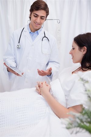 simsearch:400-05748252,k - Young doctor talking with patient about examination results Stock Photo - Budget Royalty-Free & Subscription, Code: 400-05747151