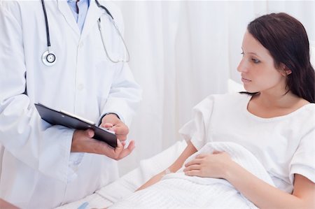 simsearch:400-05748252,k - Female patient getting examination results explained Stock Photo - Budget Royalty-Free & Subscription, Code: 400-05747153
