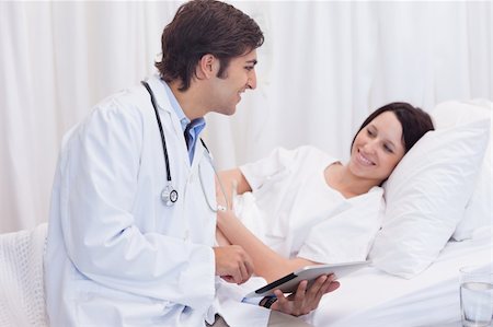 simsearch:400-05748252,k - Young doctor telling his patient the good news Stock Photo - Budget Royalty-Free & Subscription, Code: 400-05747199