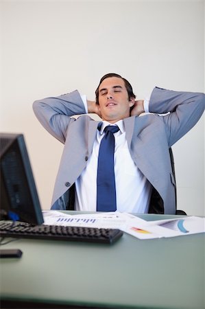 simsearch:400-05748170,k - Businessman leaning back in his chair Stock Photo - Budget Royalty-Free & Subscription, Code: 400-05748156