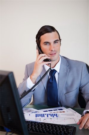 simsearch:400-05748170,k - Businessman on his desk having a phone call Stock Photo - Budget Royalty-Free & Subscription, Code: 400-05748177