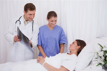 simsearch:400-05748252,k - Doctors got good news for bedridden patient Stock Photo - Budget Royalty-Free & Subscription, Code: 400-05748258