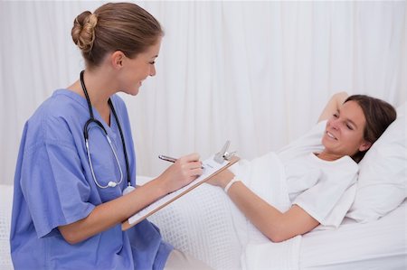 simsearch:400-05748252,k - Surgeon questioning bedridden patient Stock Photo - Budget Royalty-Free & Subscription, Code: 400-05748269