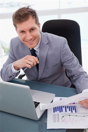 simsearch:400-04113367,k - Smiling businessman happy about market research results Stock Photo - Budget Royalty-Free & Subscription, Code: 400-05748283