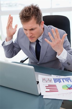simsearch:400-05748170,k - Businessman getting furious over not working laptop Stock Photo - Budget Royalty-Free & Subscription, Code: 400-05748290