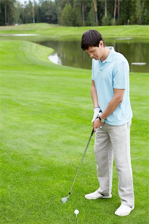 simsearch:400-05753062,k - A man playing golf Stock Photo - Budget Royalty-Free & Subscription, Code: 400-05748597