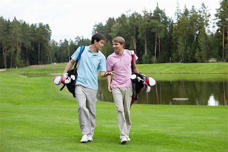 simsearch:400-05753039,k - Two young men on the golf course Photographie de stock - Aubaine LD & Abonnement, Code: 400-05748592