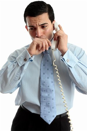 simsearch:400-05388090,k - A very worried or anxious businessman or other professional on the phone.  White background. Stock Photo - Budget Royalty-Free & Subscription, Code: 400-05748649