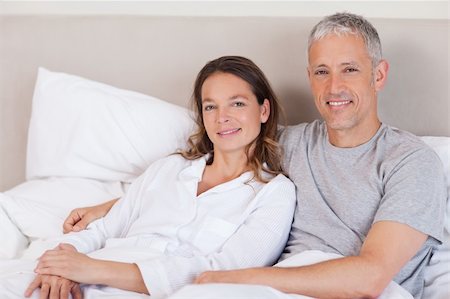 Couple lying on a bed in the morning Stock Photo - Budget Royalty-Free & Subscription, Code: 400-05749423