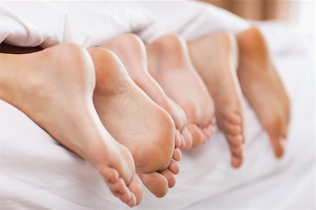 feet male sleeping - Close up of family feet in a bedroom Stock Photo - Budget Royalty-Free & Subscription, Code: 400-05749437