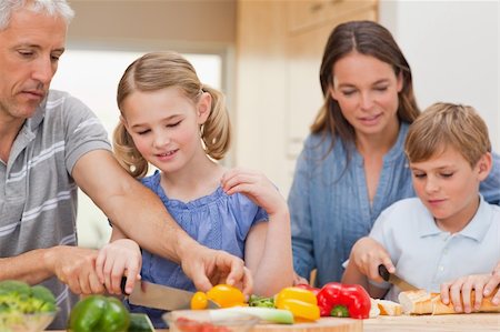 simsearch:400-05749623,k - Lovely family cooking together at home Stock Photo - Budget Royalty-Free & Subscription, Code: 400-05749569
