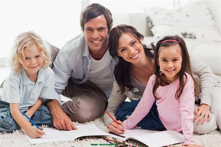 pencil painting pictures images kids - Charming family drawing together in a living room Stock Photo - Budget Royalty-Free & Subscription, Code: 400-05749705