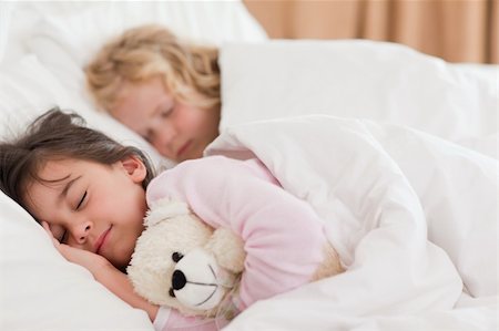 simsearch:640-06963757,k - Quiet siblings sleeping in a bedroom Stock Photo - Budget Royalty-Free & Subscription, Code: 400-05749821