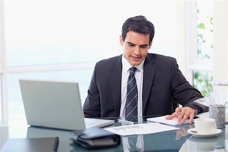 simsearch:400-04281575,k - Thoughtful businessman working in his office Stock Photo - Budget Royalty-Free & Subscription, Code: 400-05740169