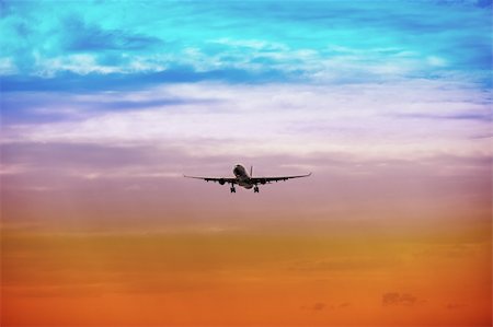 A passenger plane takes off at bright sunset Photographie de stock - Aubaine LD & Abonnement, Code: 400-05740712